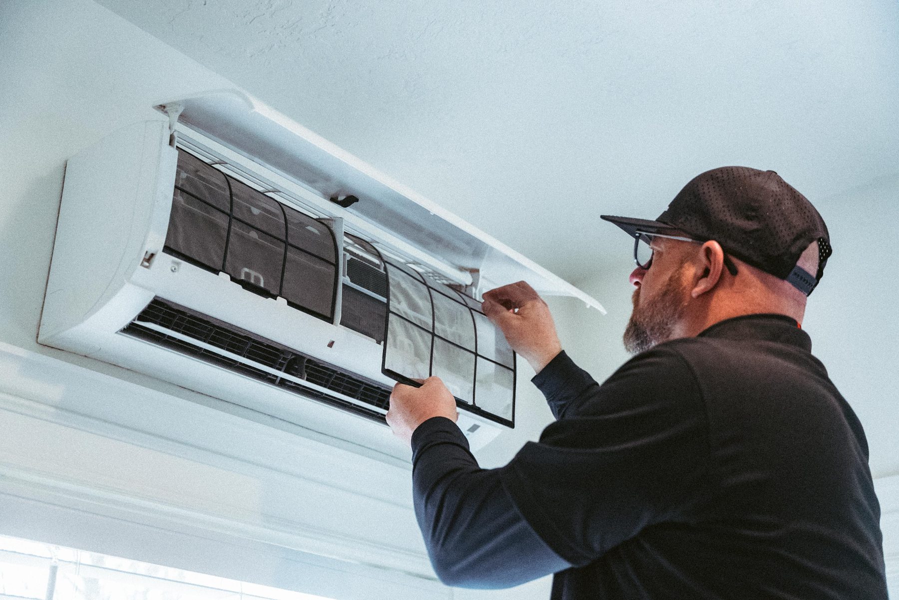 Technician servicing a ductless mini-split