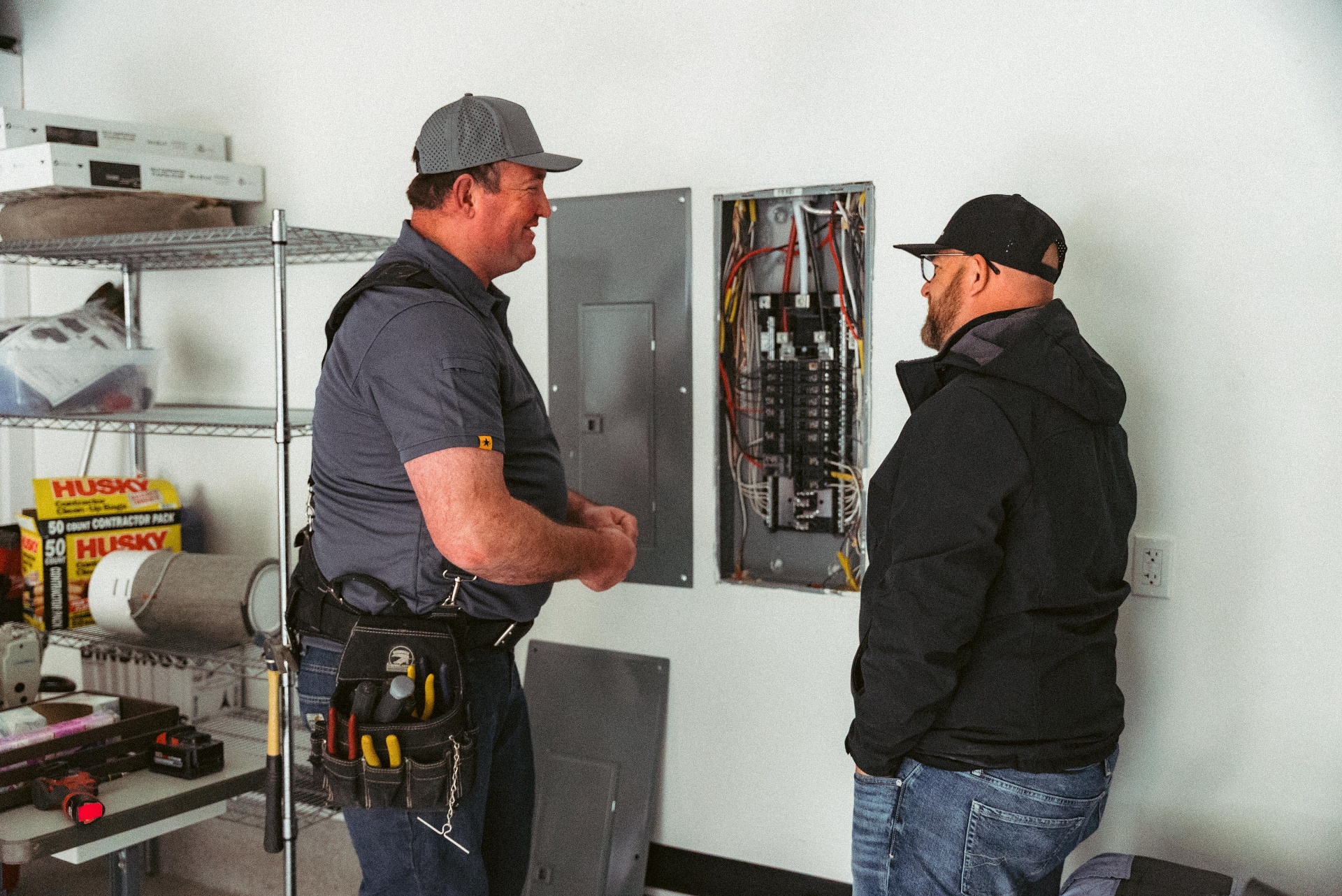 Electrician working in a breaker panel